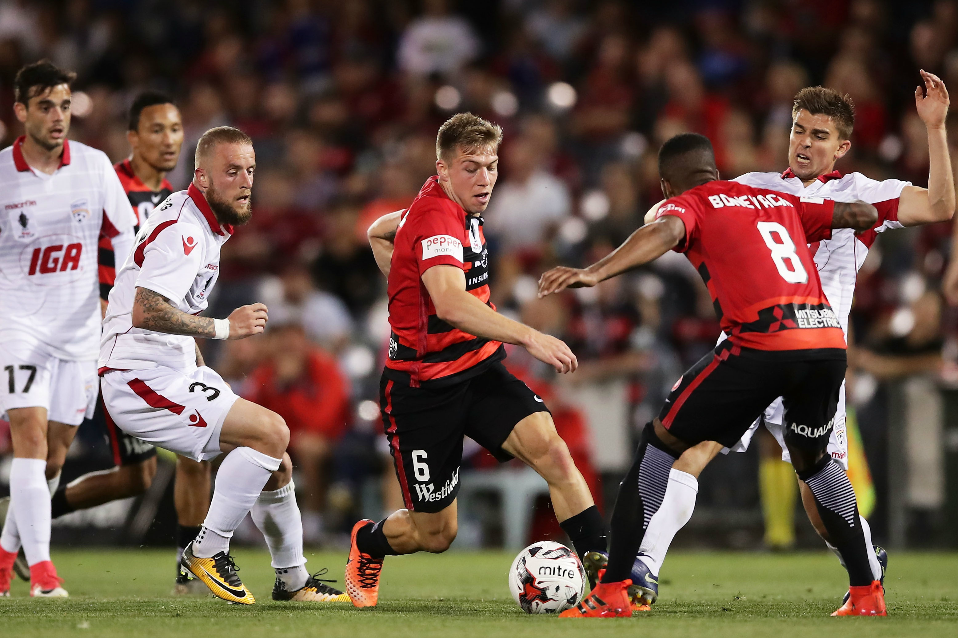 Jacob Melling on the ball against the Reds.