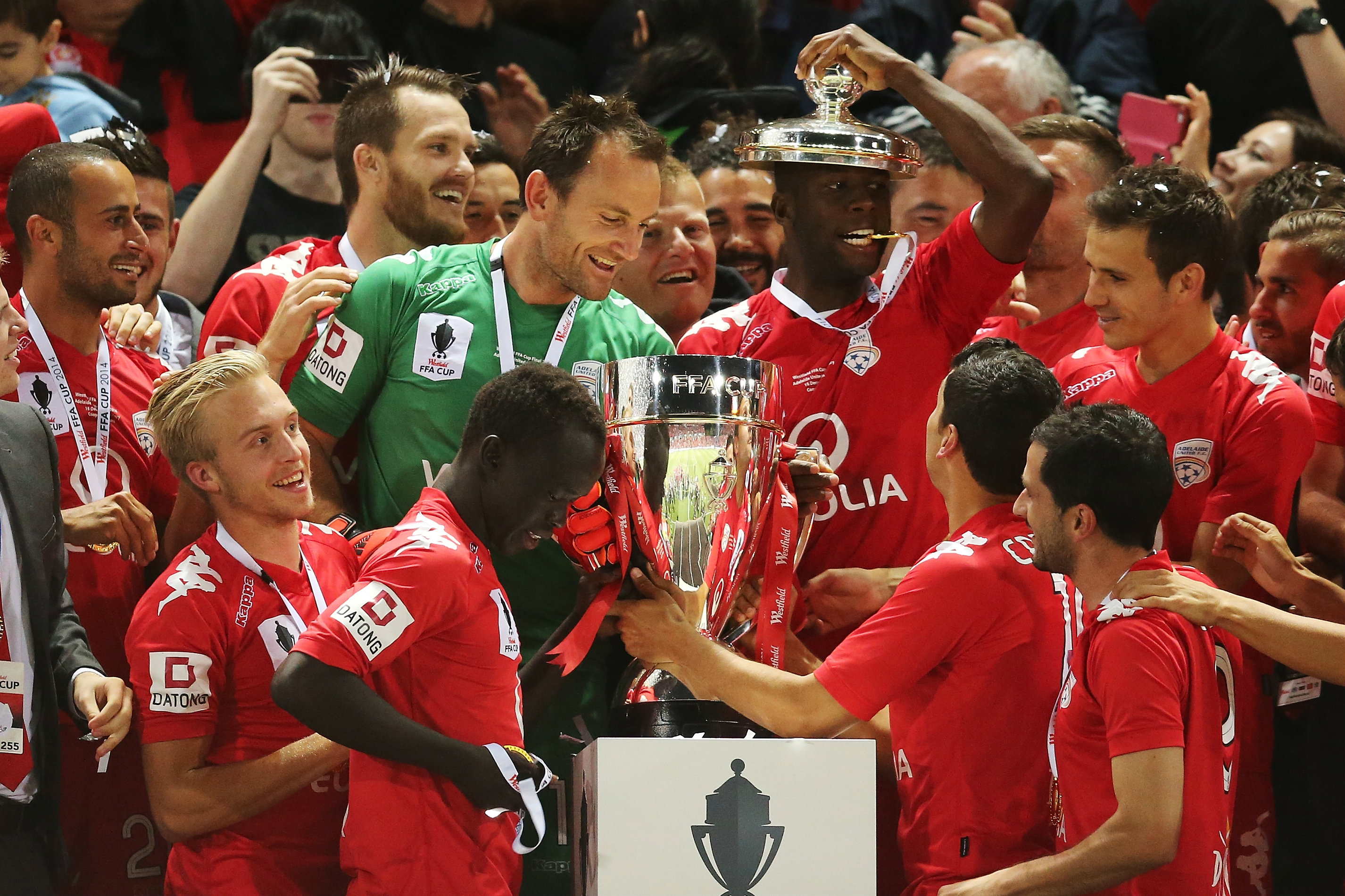Adelaide players with the FFA Cup won at Coopers Stadium in 2014.