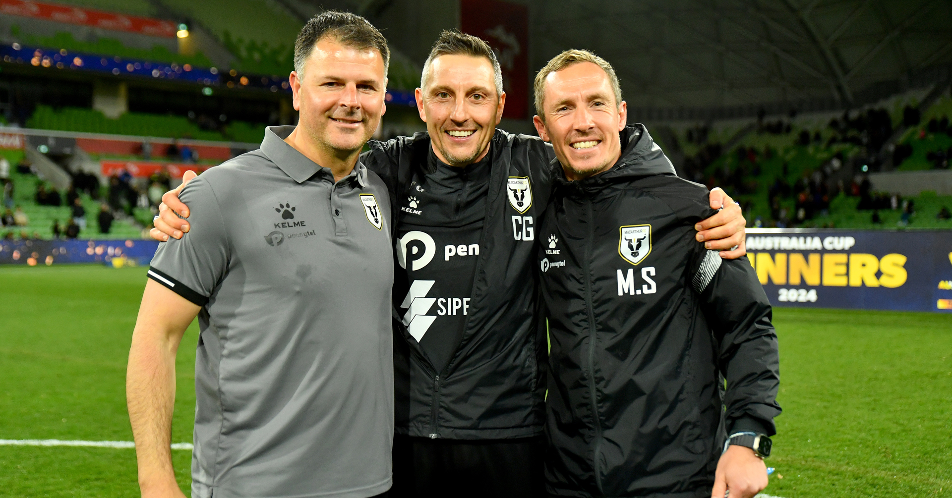 Macarthur FC Head Coach Mile Sterjovski and Macarthur FC assistant coach Christophe Gamel pose after winning the 2024 Australia Cup Final match between Melbourne Victory and Macarthur FC at AAMI Park on September 29, 2024