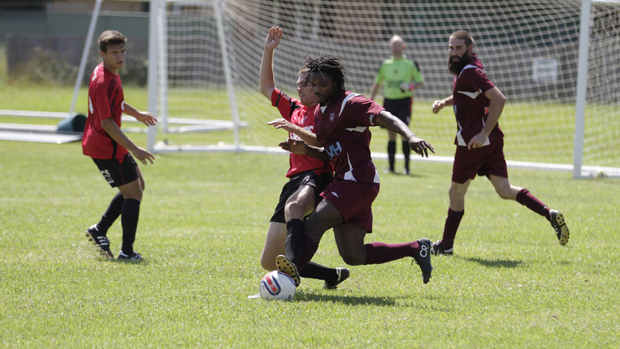 Coffs City United’s Will Bayndrian and Urunga’s Frabrice Wamara