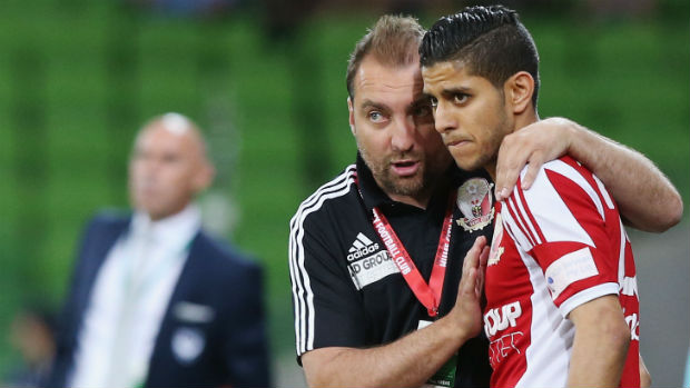 Hume City coach  Lou Acevski gives instructions to Souheil Azagane.
