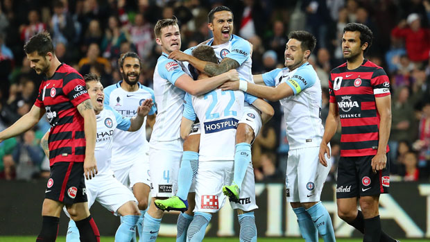 Tim Cahill celebrates with teammates during his side's 4-1 win over the Wanderers.