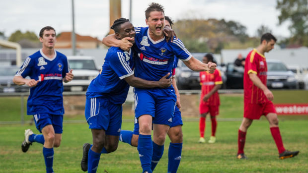 Cockburn City's Angel Andres celebrates with teammates. Photo courtesy: Vince Caratozzolo.