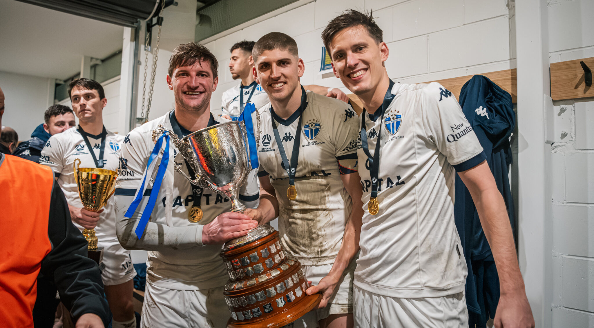 Andy Brennan, Harry Sawyer and Marco Jankovic celebrate the 2024 Dockerty Cup win after a 5-4 penalty shootout against Oakleigh Cannons. Photo credit: South Melbourne FC.