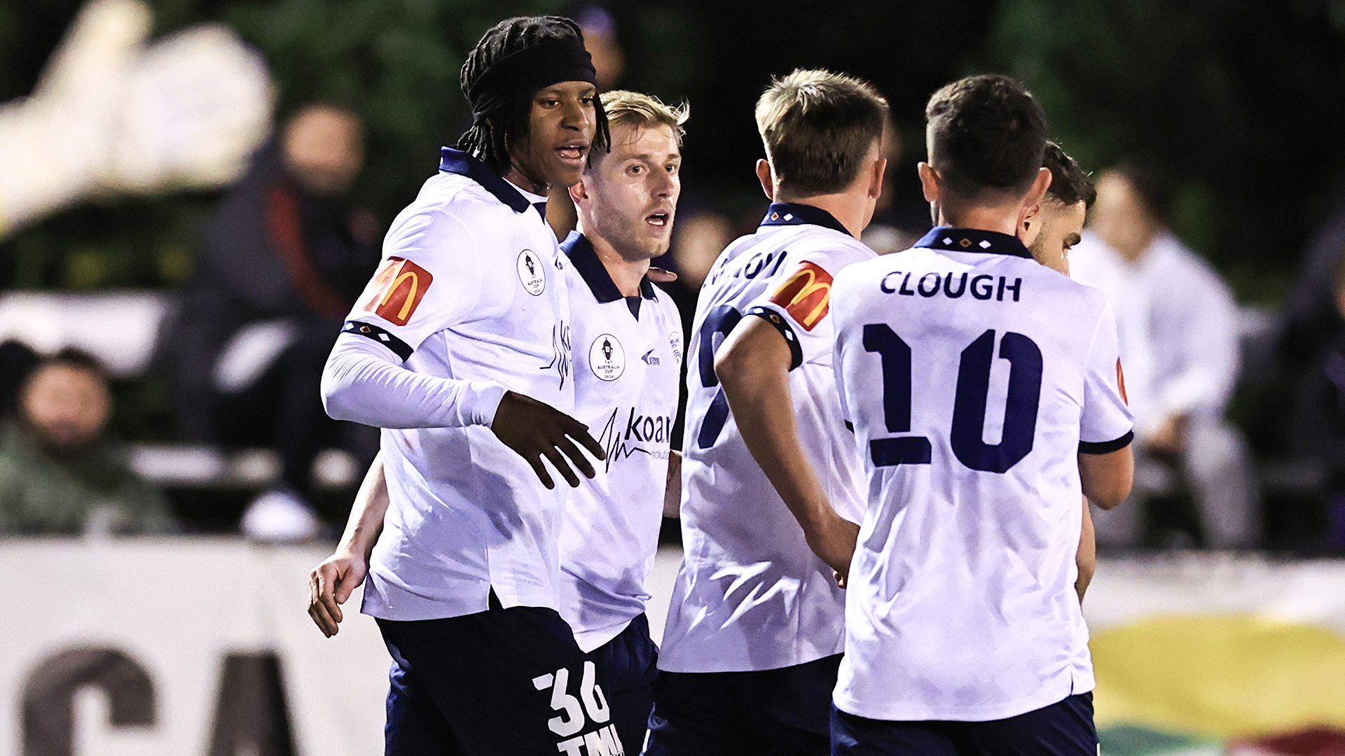 Stefan Mauk of United celebrates scoring a goal with team mates during the 2024 Australia Cup Round of 32 match between Blacktown City FC and Adelaide United FC at Landen Stadium on July 31, 2024