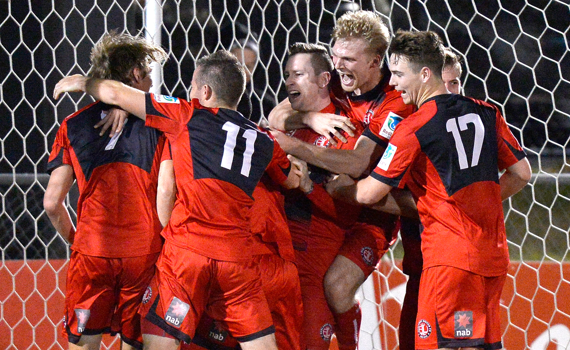Michael Lee of Redlands United is congratulated by team mates after scoring a goal to take the match into extra time