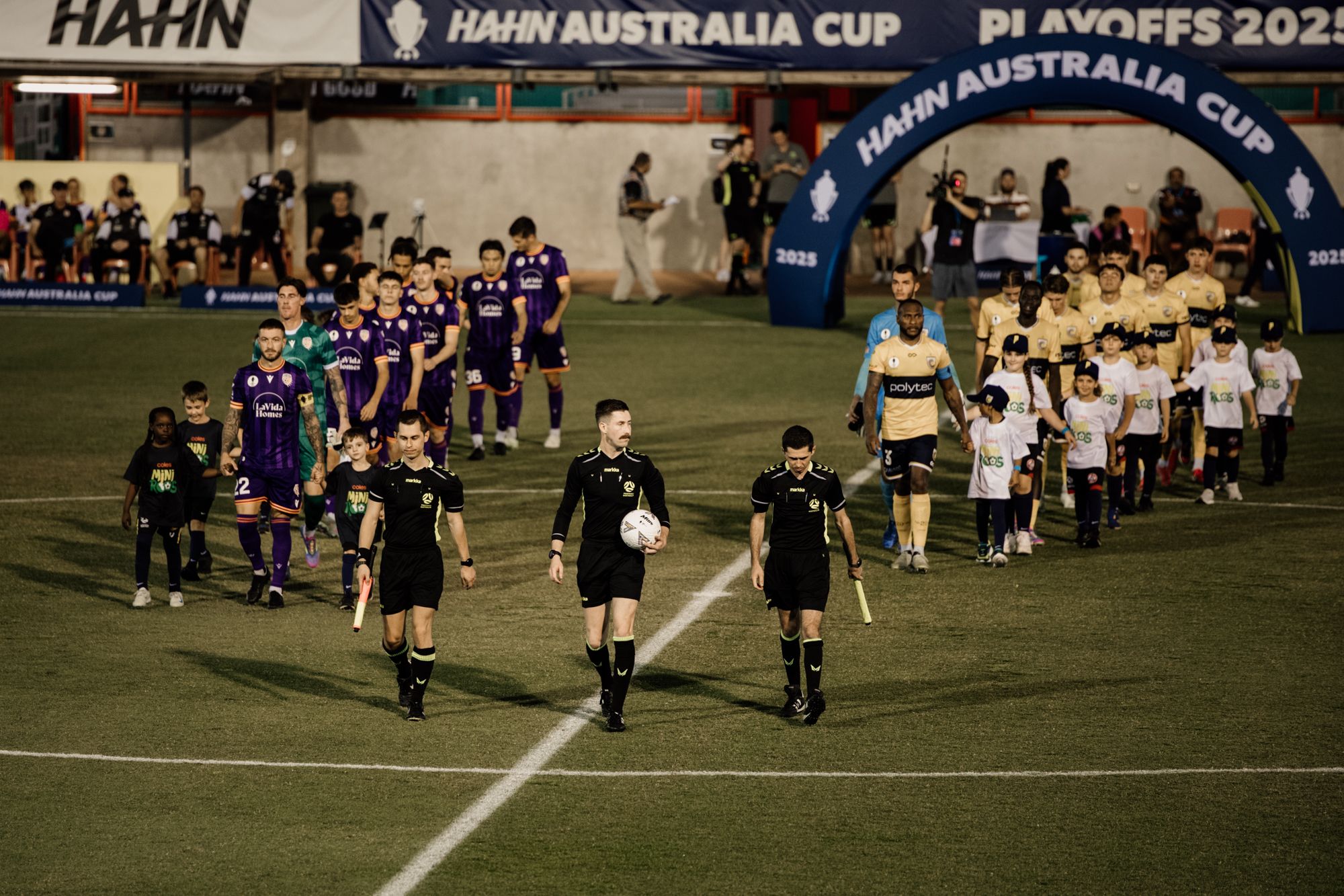 Teams enter the field in Darwin for the Australia Cup Playoff between Perth Glory and Central Coast Mariners (photo: Football Australia)