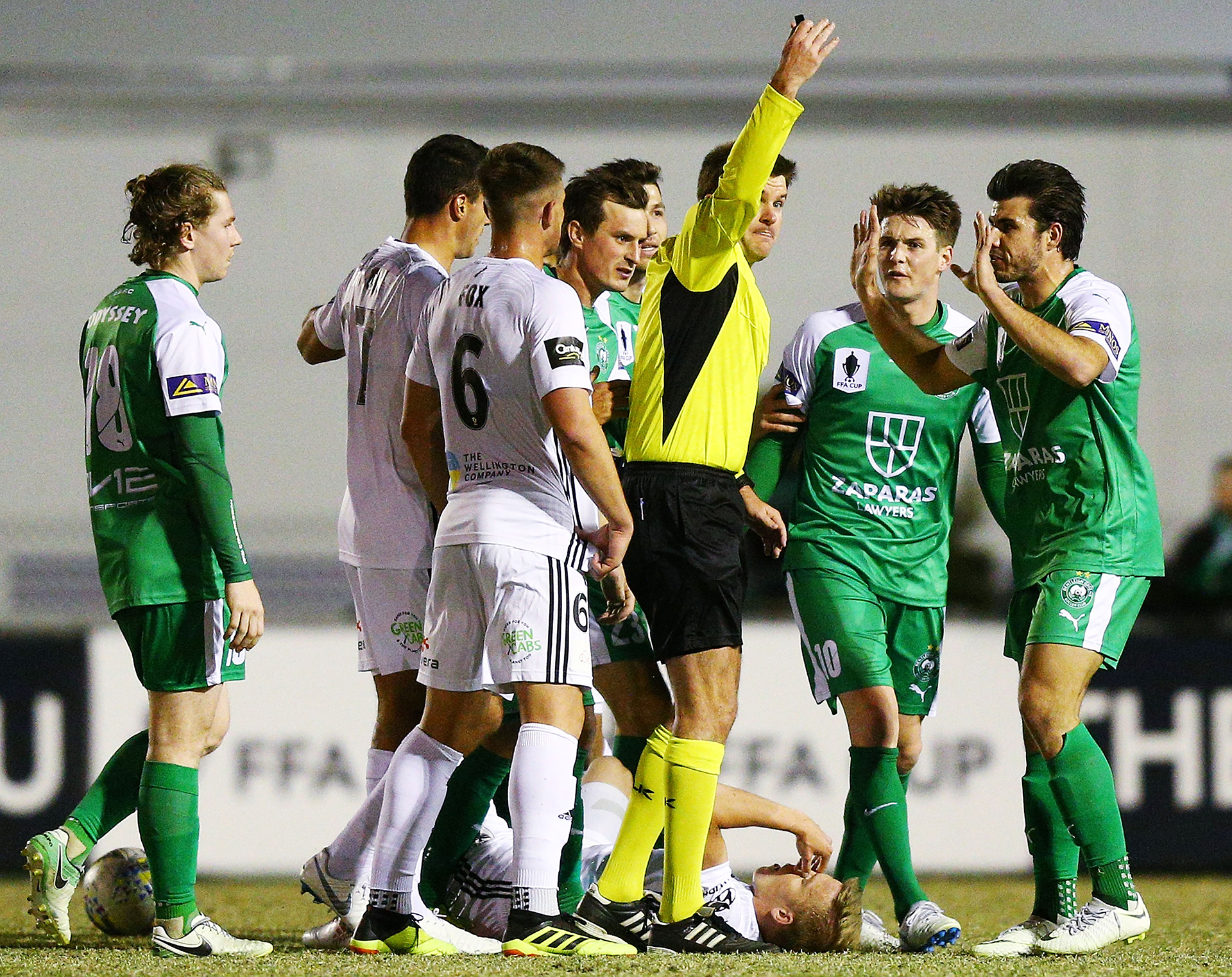 The referee orders James Kelly of Bentleigh off after a tackle during the Australia Cup round of 32 match between Bentleigh Greens and Wellington Phoenix at Kingston Heath Soccer Complex on August 7, 2018