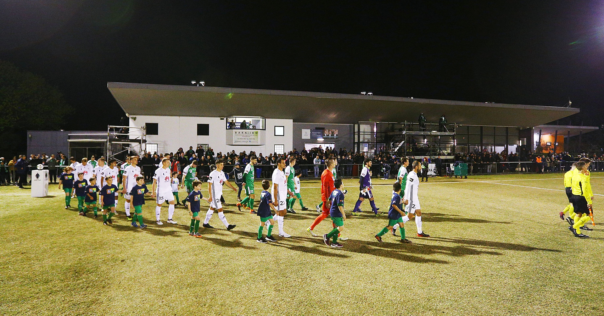 Players walk out during the Australia Cup round of 32 match between Bentleigh Greens and Wellington Phoenix at Kingston Heath Soccer Complex on August 7, 2018