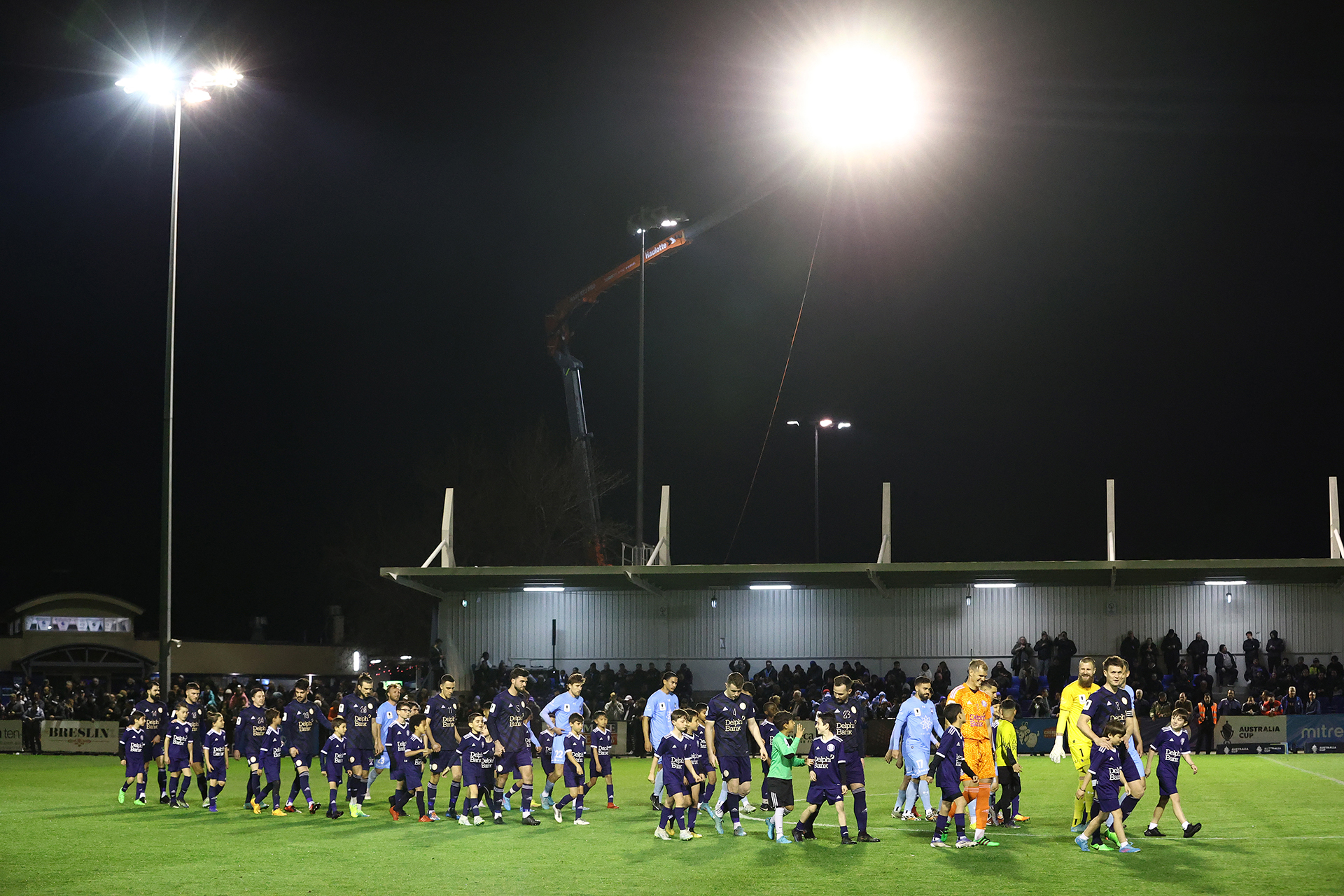 Oakleigh Cannons and Sydney FC walk onto the pitch ahead of their Australia Cup Quarter Final clash