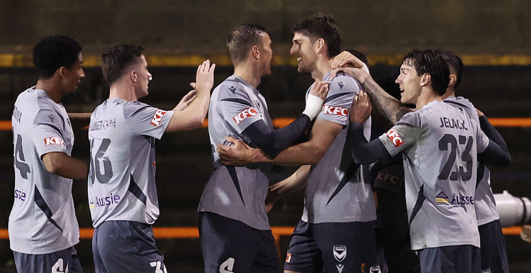 SYDNEY, AUSTRALIA - AUGUST 19: Harrison Sawyer of Victory celebrates with team mates after scoring a goal during the Australia Cup Quarterfinal match between APIA Leichhardt and Melbourne Victory FC at Leichhardt Oval, on August 19, 2026 in Sydney, Australia. (Photo by Matt King/Getty Images)