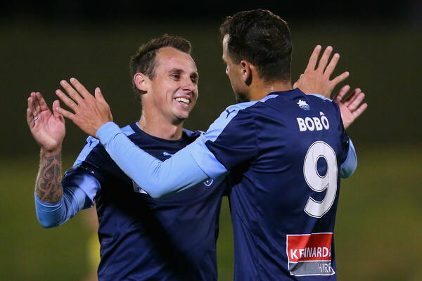 Luke Wilkshire and Bobo celebrate a Sydney FC goal during the Westfield FFA Cup.