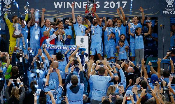 Sydney FC lifting the 2017 FFA Cup trophy