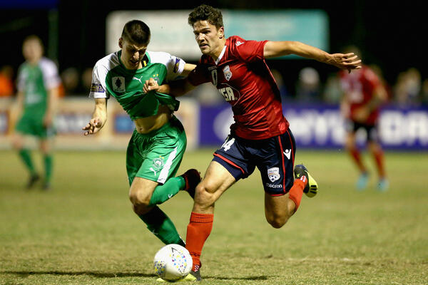 Reds attacker George Blackwood holds off his Bentleigh opponent.
