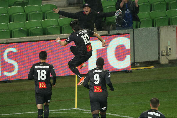 Dimitri Petratos celebrates his goal at AAMI Park by kicking the corner flag