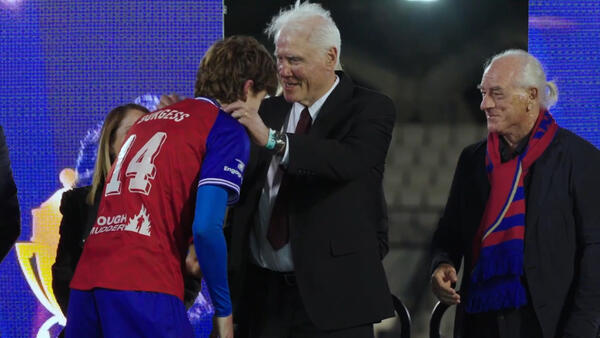 Max Burgess reacts to being awarded the Mark Viduka Medal