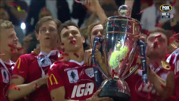 Adelaide United hoist the FFA Cup Trophy