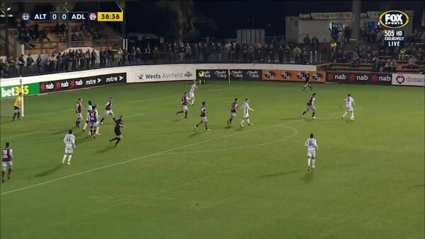 Symons clears it off the line