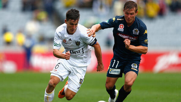 Phoenix fullback Louis Fenton holds off Mariners winger Nick Fitzgerald.
