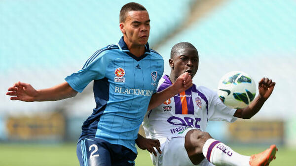Keifer Dotti tries to win the ball off Glory's Moses Kalua in 2012.