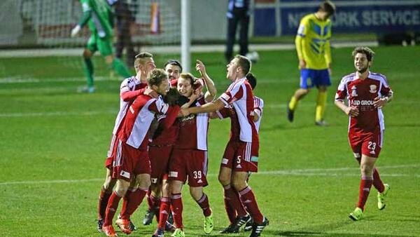 Hume City players celebrate a goal in that epic opening night win over Brisbane Strikers.