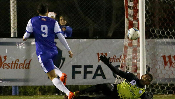Canberra Olympic star Philipe Bernabo-Madrid scores during the Round of 32 against Surfers Paradise.