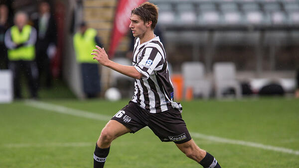 Thomas Love in action for Adelaide City in their FFSA Federation Cup win.