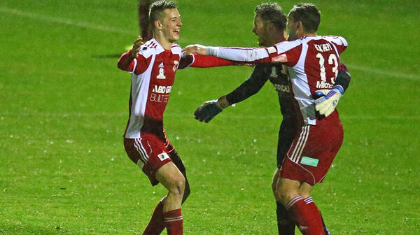 Hume City players celebrate at full-time following their 3-2 win over Oakleigh Cannons.