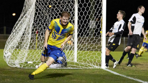 Brisbane Strikers' Cameron Draper celebrates scoring against Moreton Bay United.