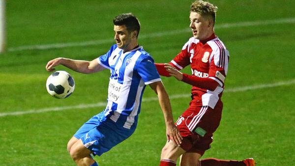 Matt Hennessey fights for the ball in the Round of 16 clash against Sydney Olympic.