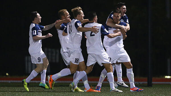 Palm Beach Sharks players celebrate scoring through Daniel Dragicevic.