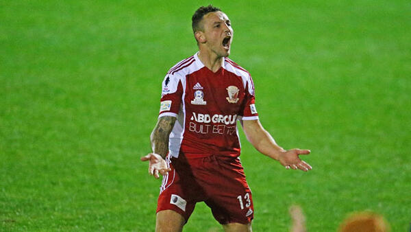 Hume City defender Shane Rexhepi celebrates a goal against Sydney Olympic.