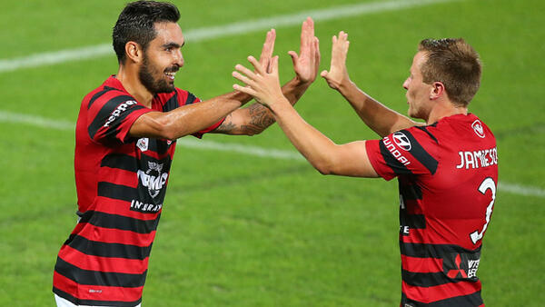 Dimas Delgado celebrates with Scott Jamieson after scoring the Wanderers' opener against Palm Beach.