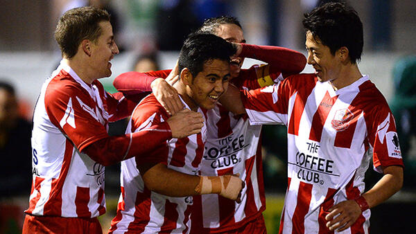Olympic FC celebrate a goal in their 3-1 win over Melbourne Knights.