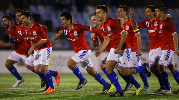 Sydney United players celebrate winning the penalty shootout against South Hobart.