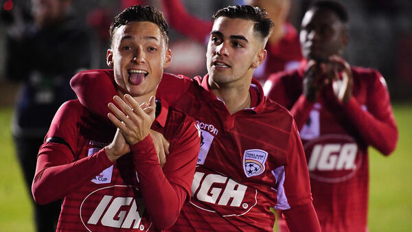 Adelaide United players Jordan O'Doherty and Ben Garuccio thank the fans after their win over Melbourne Victory.