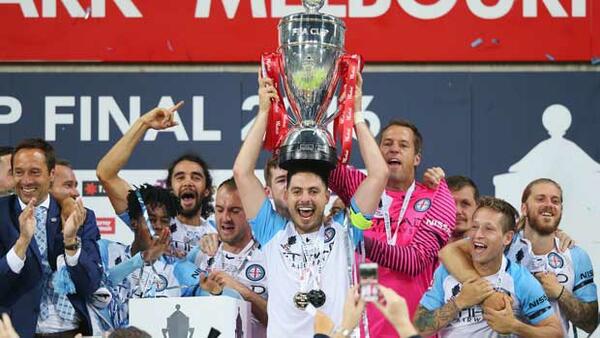 Melbourne City skipper Bruno Fornaroli lifts the Westfield FFA Cup trophy after their triumph in 2016.