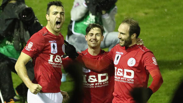 Jacob Colosimo celebrates his goal with Melbourne Knights team-mates.