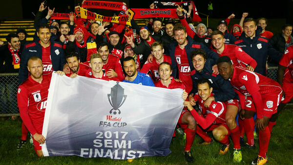 Adelaide United moved into the Westfield FFA Cup semi finals with a big win over Heidelberg United.
