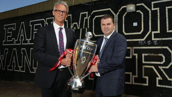 FFA CEO David Gallop holds the Westfield FFA Cup trophy alongside Socceroos boss Ange Postecoglou.