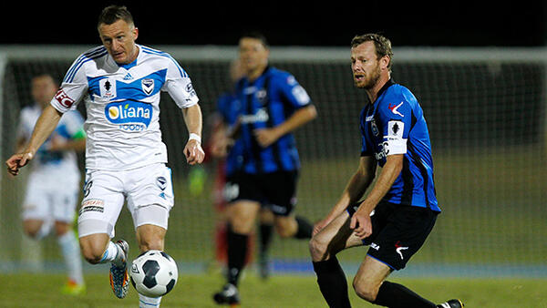 Melbourne Victory's Besart Berisha scoots away with possession against Bayswater.