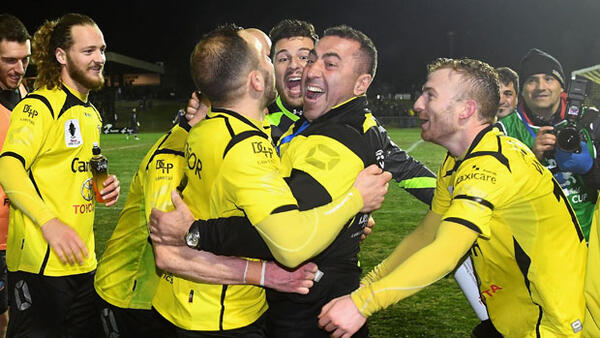 Heidelberg players celebrate following their win over Perth Glory.
