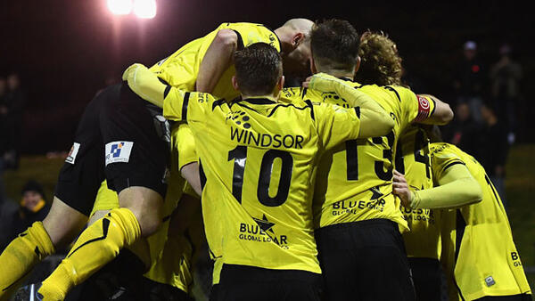 Heidelberg players celebrate after Ken Athiu netted against Perth Glory.