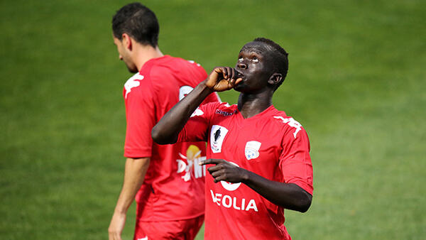 Awer Mabil celebrates scoring Adelaide's second goal.