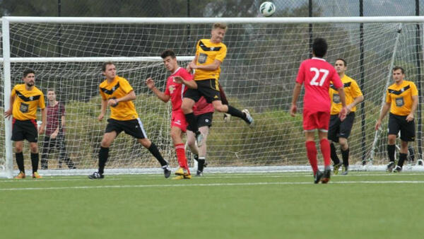 Kings Domain FC players defend their goal. Image courtesy Cindy Nitsos.