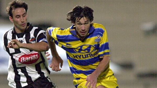 Brisbane Strikers midfielder Wayne Shroj and City forward Aurelio Vidmar in the old National Soccer League