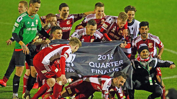Hume City players celebrate following their win over Sydney Olympic.