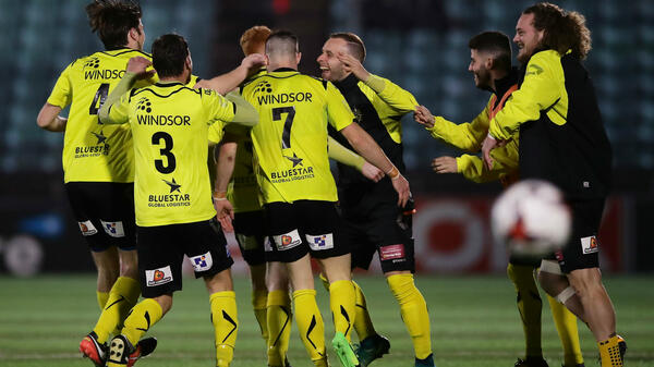 Heidelberg United players celebrate their FFA Cup win over Sydney United 58.