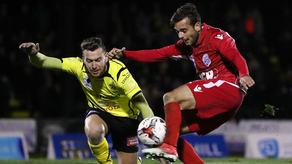 Nikola Mileusnic gets a shot away during Adelaide United's Westfield FFA Cup win over Heidelberg United.