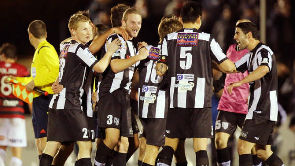 Adelaide City players celebrate beating Western Sydney in the first season of the Westfield FFA Cup.